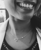 model wearing silver small signature lamb necklace