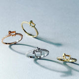 stackable rings with paved mini diamonds and lamb logo