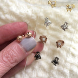 Julie Lamb stud earrings in white gold, yellow gold, sterling silver, and black diamond