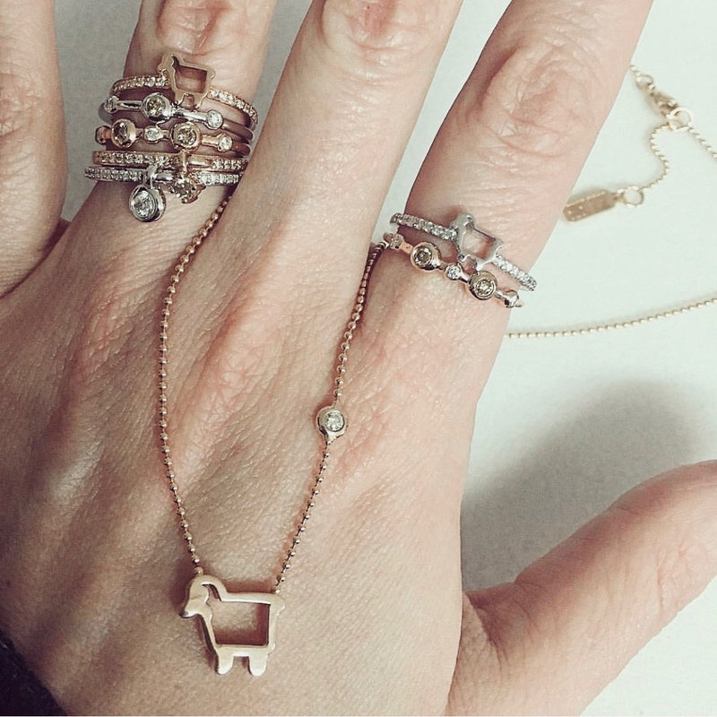 stackable rings with lamb logos and diamonds