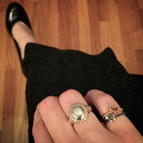 Julie Lamb rings with lamb logo and diamond and moonstone