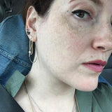 model wearing Julie Lamb's earrings with diamonds