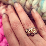 stackable rings in lamb logo and diamonds