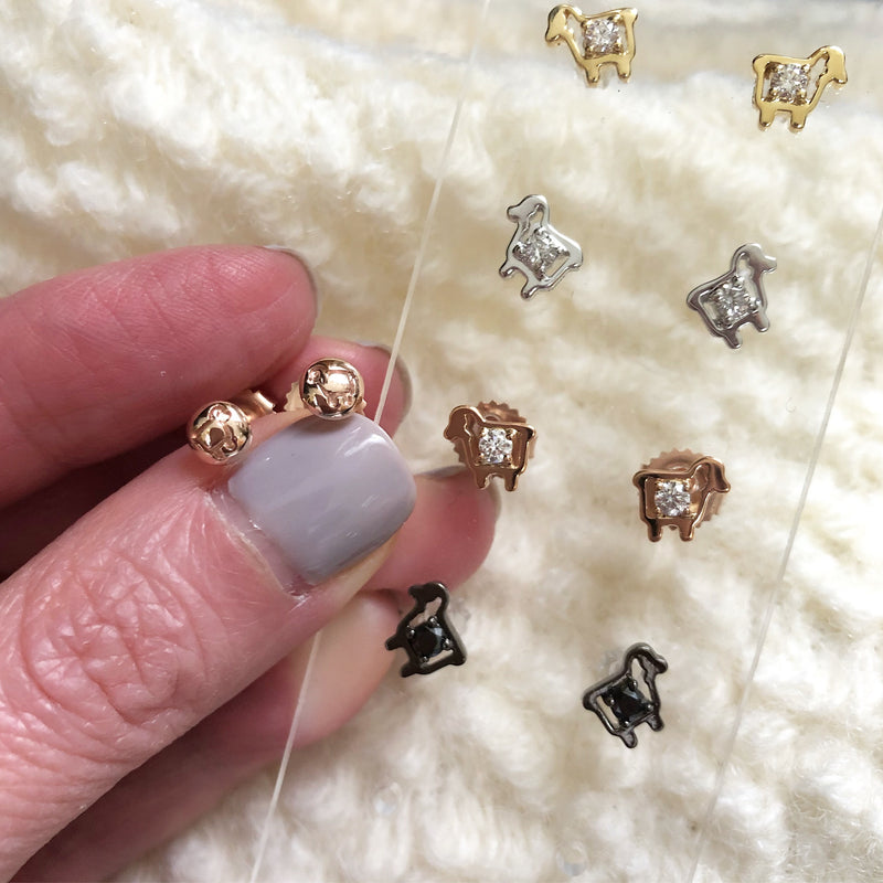 Collection of lamb logo earrings with diamonds