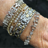 18K white gold lamb logo link bracelet with diamond shown on wrist bracelet stack 