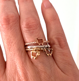 Lamb logo ring with pavé diamonds in fine metals shown on finger